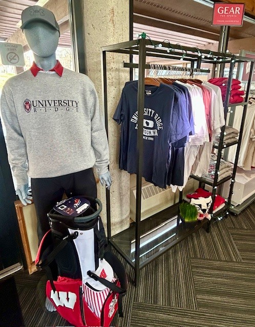 University Ridge branded shirts on a rack next to a mannequin